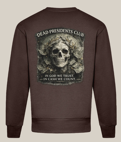 Brown sweatshirt with a skull and money design on the back, featuring text 'Dead Presidents Club' and 'In God We Trust, In Cash We Count'.
