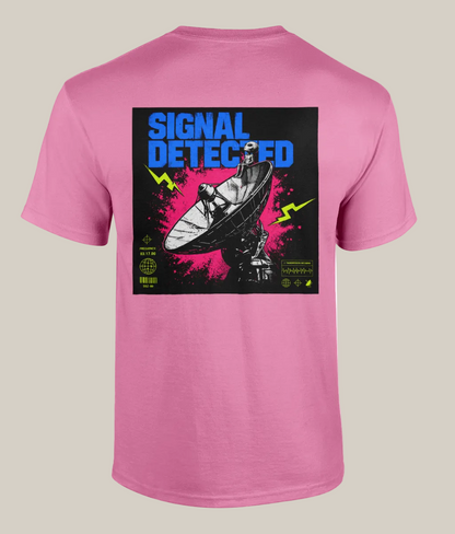Pink t-shirt with a graphic design on the back featuring a satellite dish and text 'Signal Detected' on a white background.