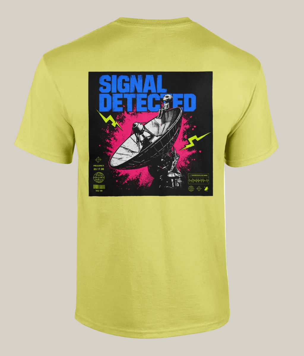 Yellow t-shirt with graphic design and text 'Signal Detected' on a white background